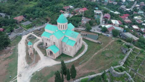 Circular-aerial-drone-shot-around-Bagrati-Cathedral-in-Kutaisi,-Georgia