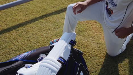 Young-cricketer-wearing-kneepad.-Handheld-shot