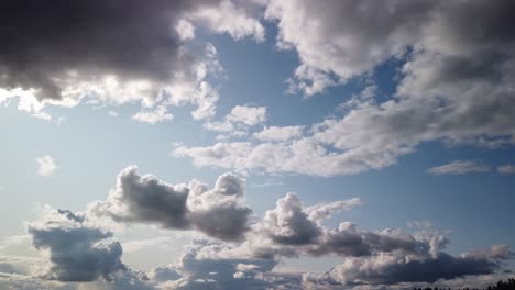 Left-to-right-pan-time-lapse-of-boiling-clouds,-storm,-flashes-of-bright-white,-blue