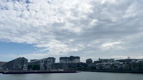 Passing-Wharf-Harbour-with-passing-bird-in-Sydney-Australia-on-cloudy-day