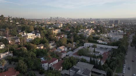 Los-Angeles-city-skyline-as-seen-from-Hollywood-Hills---rising-aerial-reveal