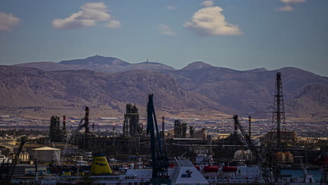 Timelapse,-Clouds-Moving-Above-Hills,-Elefsina-Harbor-and-Hellenic-Petroleum-Industrial-Site,-Athens-Greece