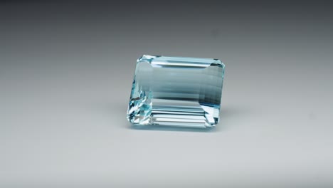 Polished-blue-gemstone-rotates-and-sparkles