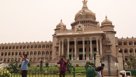 Time-lapse-of-visitors-watching-Vidhana-Soudha-or-parliament-or-legislative-assembly-of-Karnataka-at-Bangalore,-India