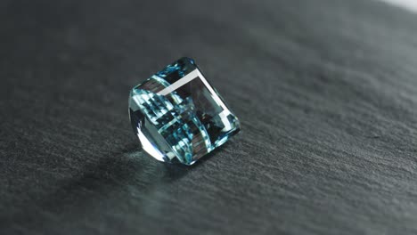 Polished-blue-gemstone-rotates-and-sparkles