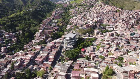 Aerial-view-of-Medellin's-Comuna-13-with-the-Metrocable,-Colombia