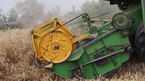 Wheat-Field-With-A-Combine-Harvester,-Plowing-Harvesting-Machine-Drives-On-A-Big-Field-Of-Wheat-Crop,-Urban-Farming-technology