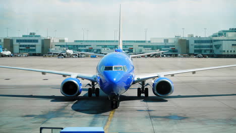 DIA-Airport-in-Denver-Colorado-a-plane-pulling-into-jet-bridge