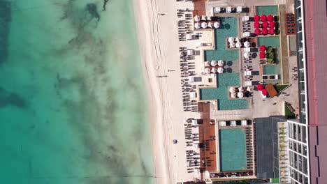 Top-Down-Aerial-View,-Luxury-Waterfront-Hotel-Resort-and-Beach-on-Caribbean-Sea