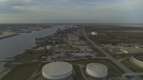 Mobile-Alabama-Aerial-v9-Flying-over-industrial-river-area-at-sunset---March-2020