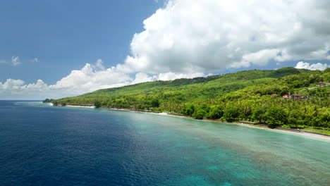 Beautiful-green-landscape,-village-locations,-crystal-clear-ocean-water