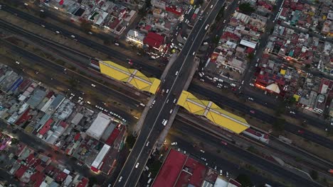 Avenida-Central-hyperlapse-from-drone,-metro-and-neighborhoods-in-Ecatepec,-CDMX,-Mexico