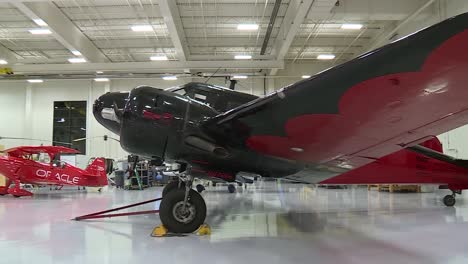 Several-airplanes-sitting-in-a-hanger