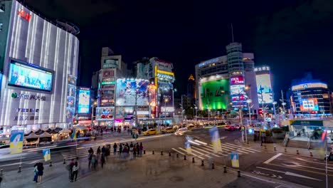 Timelapse-of-Bustling-Taipei-Cityscape-with-Neon-Lights,-Traffic,-and-People-at-Night-in-Ximen-District,-Taiwan-TILT