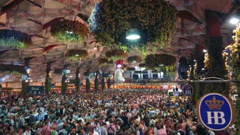 4K-UHD-timelapse-of-the-famous-beer-tent-Hofbräu-on-the-world-famous-Munich-Oktoberfest---Wiesn-with-a-seamless---endless-loop-of-Aloisius-turning-above-the-dancing-crowd