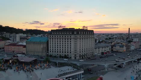 Aerial-view-of-the-facade-of-the-Grand-Hotel-of-Kiev-with-the-sunset-behind