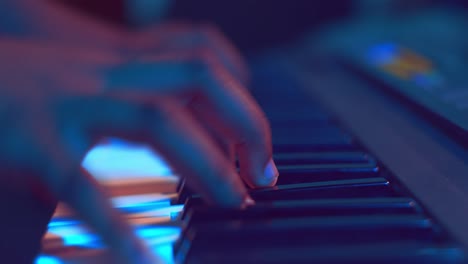 Close-up-of-hands-playing-piano