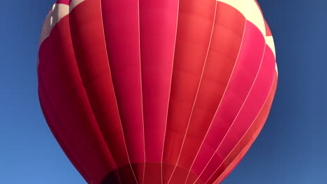 Hot-air-balloon-launches-from-the-park-while-spinning-for-the-crowd