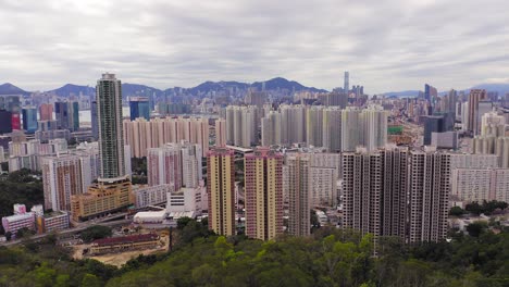 Aerial-view-of-Hong-Kong-residential-buildings-with-Victoria-harbour-in-the-horizon