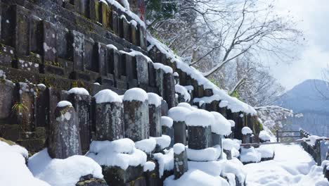 Stone-tombs-at-snowy-mountain-shrine-Yamadera-in-Northern-Japan