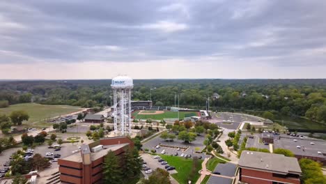 Aerial-View-Of-Baseball-Stadium-And-Water-Tower-In-Downtown-Beloit,-Wisconsin-With-Overcast