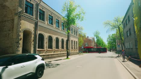 Floating-through-Daugavpils-city-centre-on-sunny-day-observing-architecture