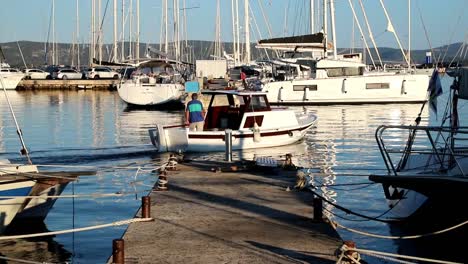 Boats-leaves-marina-in-the-morning-in-Biograd-in-Croatia-in-slowmotion