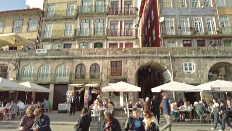 Colorful-traditional-facades-in-Porto's-Ribeira-district-under-a-clear-blue-sky