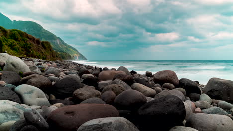Time-lapse-of-the-sea-with-strong-waves-crashing-to-the-rocky-shore-on-a-cloudy-day