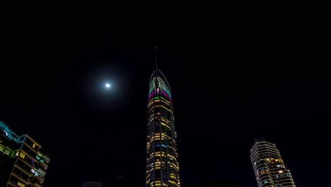 Timelapse-of-top-view-of-buildings-in-the-Gold-Coast-with-moon-in-the-background