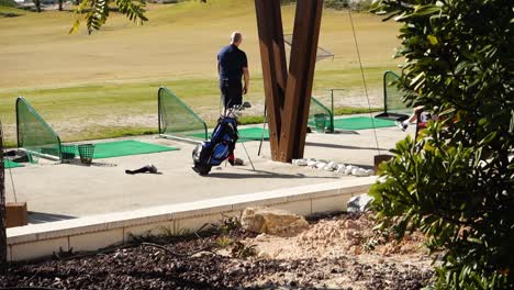Man-practicing-on-driving-range-at-Vistabella-golf-club