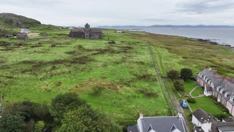 Aerial-View-of-Iona-Island-Village-and-Abbey-Nunnery-Building,-Homes,-Landmark-and-Landscape,-Scotland-UK