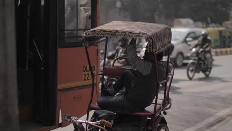 A-man-chilling-on-a-rikshaw