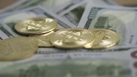 bitcoin-golden-coin-falling-above-100-note-dollars-bill