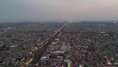 Dusk-from-drone-in-Ecatepec,-CDMX-and-Edomex