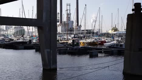 Boats-Docked-in-Yacht-Harbor-Industrial-background,-Amsterdam-Marina-Time-Lapse