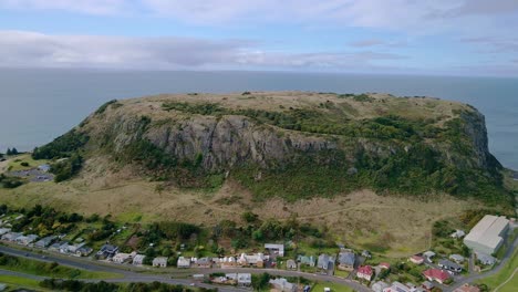 Rotating-aerial-shot-of-The-Nut-bluff-and-Stanley-town-in-Tasmania,-Australia