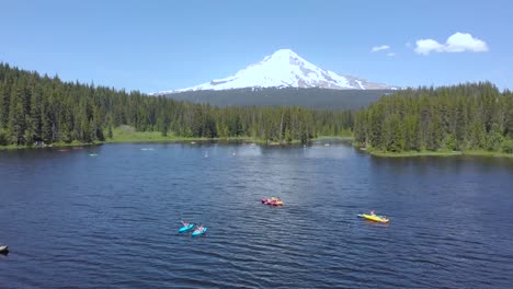 Aerial-footage-of-People-kayaking-in-a-mountain-lake