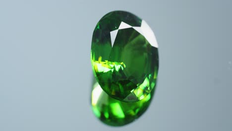 Polished-green-gemstone-rotates-and-sparkles