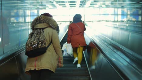 Using-a-escalator-in-Osaka,-Japan-to-get-up-to-the-surface