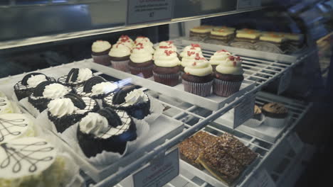 Assortment-cupcakes-in-a-bakery-display-in-San-Jose,-California