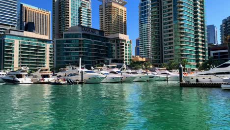 Dubai-Marina-Harbour-View-From-Yacht-on-Arabian-Skyscrapers,-UAE