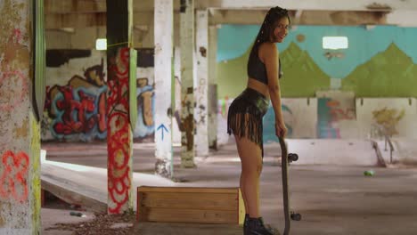 Within-the-dynamic-environment-of-an-indoor-skate-park,-a-girl-in-a-mini-skirt-rides-her-skateboard