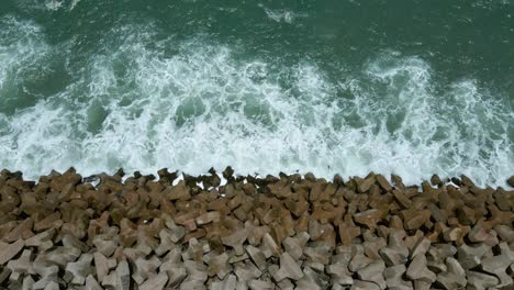 Drone-shot-of-the-great-wall-of-Lagos-and-Eko-Atlantic-City-viewpoint-looking-into-the-Atlantic-ocean