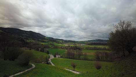 Landscape-surrounding-Gruyères,-Switzerland,-on-a-cloudy-day