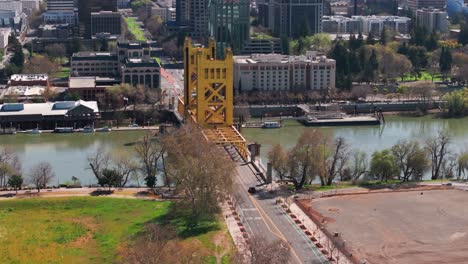 Telephoto-drone-shot-over-Tower-Bridge-in-Sacramento,-California-on-a-sunny-day