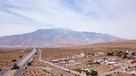 Highway-62-in-Desert-hot-springs-and-Palm-Springs,-with-a-view-of-San-Jacinto-Mountain,-right-by-the-famous-Palm-Spings-Windmills