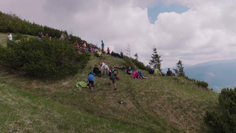 Group-of-tourists-having-a-rest-and-picnic-on-top-of-the-hill-Salatin-in-Velka-Fatra-Slovakia,-static-shot