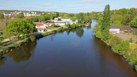 Vienne-River-crossing-Limoges-city,-France.-Aerial-forward