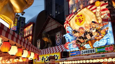 Night-view-of-restaurants-around-Tsutenkaku-Tower-in-Shinsekai-district-of-Osaka,-Japan